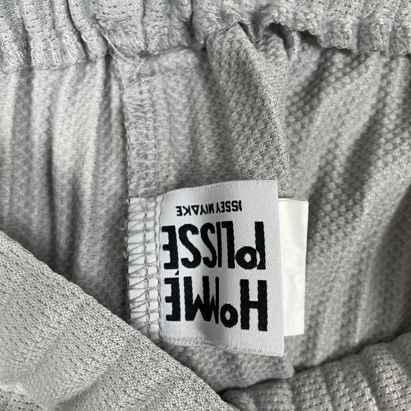 ISSEY MIYAKE HOMME PLISSE PERFORATED PANTS